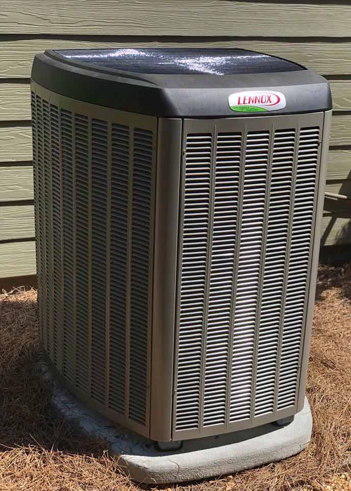Lennox outdoor AC unit next to a home.